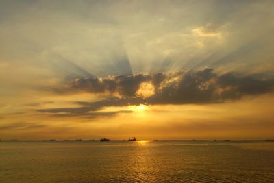 Scenic view of sea against dramatic sky