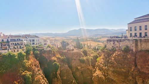 Panoramic view of buildings in town against clear sky