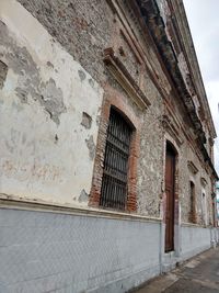 Low angle view of old building against sky