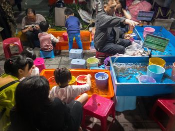 High angle view of people sitting outdoors