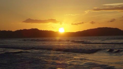 Scenic view of sea at sunset