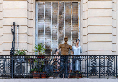 Couple standing against railing