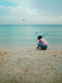 Man sitting on beach