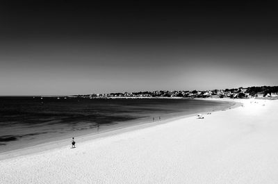 Scenic view of beach against clear sky