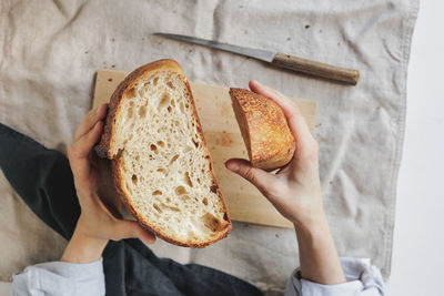 Cropped hand of person holding food