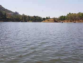 Scenic view of river against clear sky