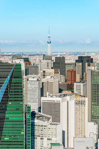 Modern buildings in city against sky