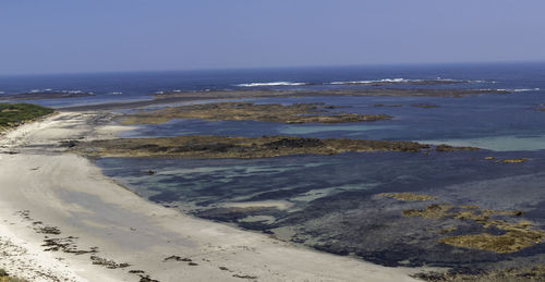 Scenic view of beach against clear sky