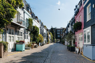 View of the picturesque st lukes mews alley near portobello road in notting hill, london