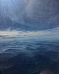 Aerial view of cloudscape over mountains