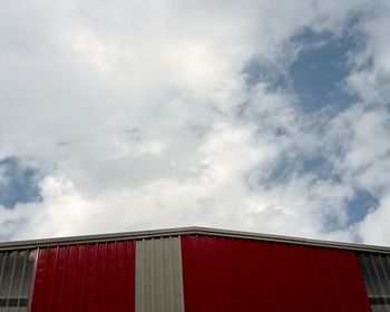 Low angle view of red building against sky