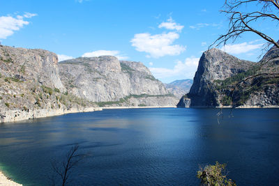 Scenic view of sea and mountains against sky