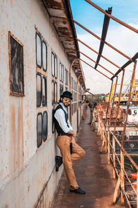 Full length portrait of young man standing outdoors