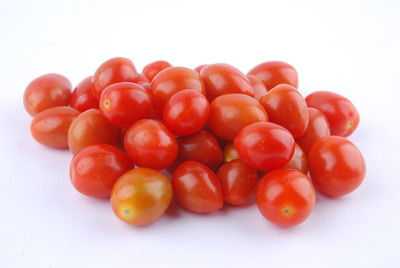 Close-up of tomatoes against white background