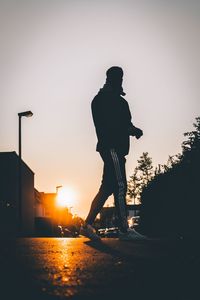 Low angle view of silhouette statue against sky during sunset