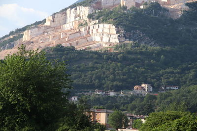 Buildings in town against mountain