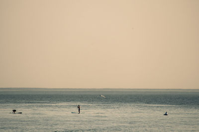 Scenic view of sea against clear sky during sunset
