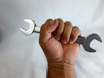 Close-up of hand holding stick