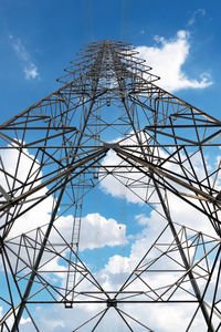 Closeup of high voltage pole on sky background.