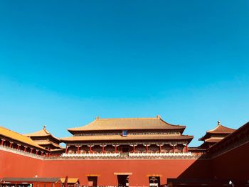 Low angle view of building against blue sky