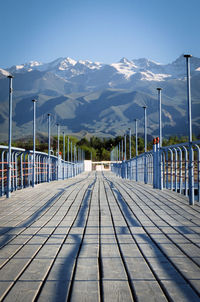 Landscape with pier on the mountains background