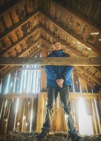 Rear view of man standing in temple