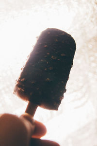 Cropped image of person holding ice cream