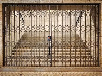 Chainlink fence in front of building