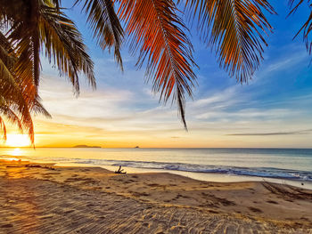 Scenic view of sea against sky at sunset