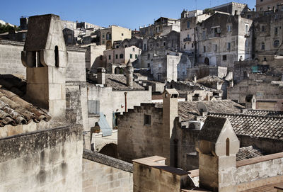 Buildings in town against clear sky