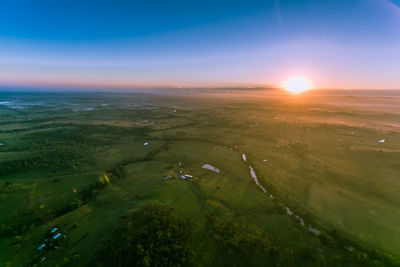 Scenic view of landscape against sky during sunset