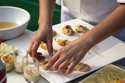 Cropped image of chef preparing food