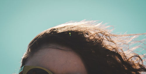 Cropped image of woman with tousled hair