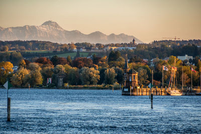 Entrance to the port of constance in autumn with a view of the säntis