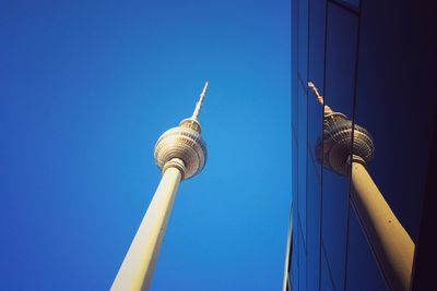 Low angle view of tower against clear blue sky