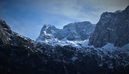 Panoramic view of snowcapped mountains against sky
