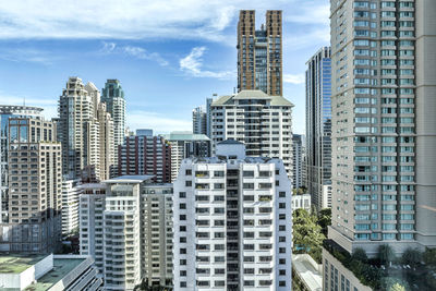 Modern buildings in city against sky