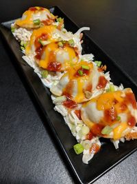 High angle view of serving food in plate on table