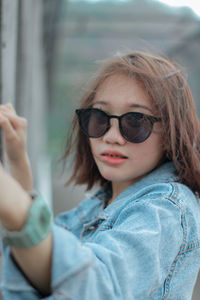 Portrait of cute girl wearing sunglasses