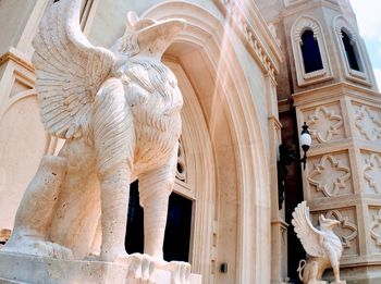 Low angle view of statue of historic building