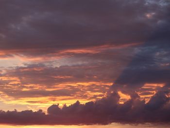 Low angle view of dramatic sky during sunset