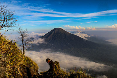 View of volcanic mountain against cloudy sky