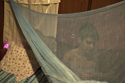 Low section of woman on bed