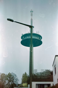 Low angle view of street light against sky during rainy season