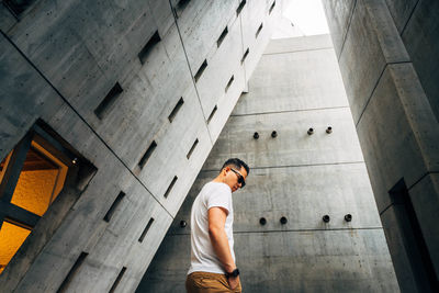 Man standing amidst building