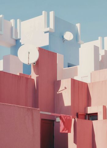 Low angle view of residential building during sunny day