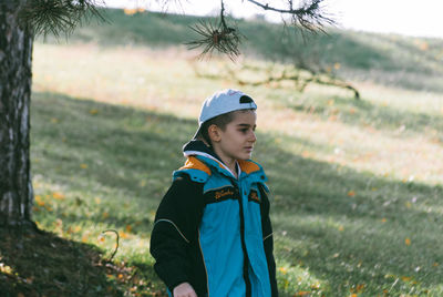 Boy on grassy field