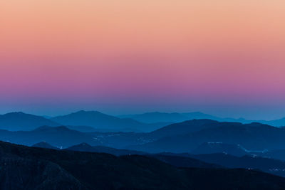 Scenic view of mountains against sky during sunset