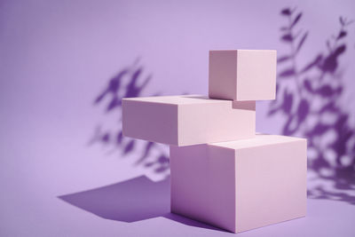 Close-up of cubes over purple background