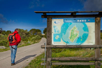 Woman standing on footpath